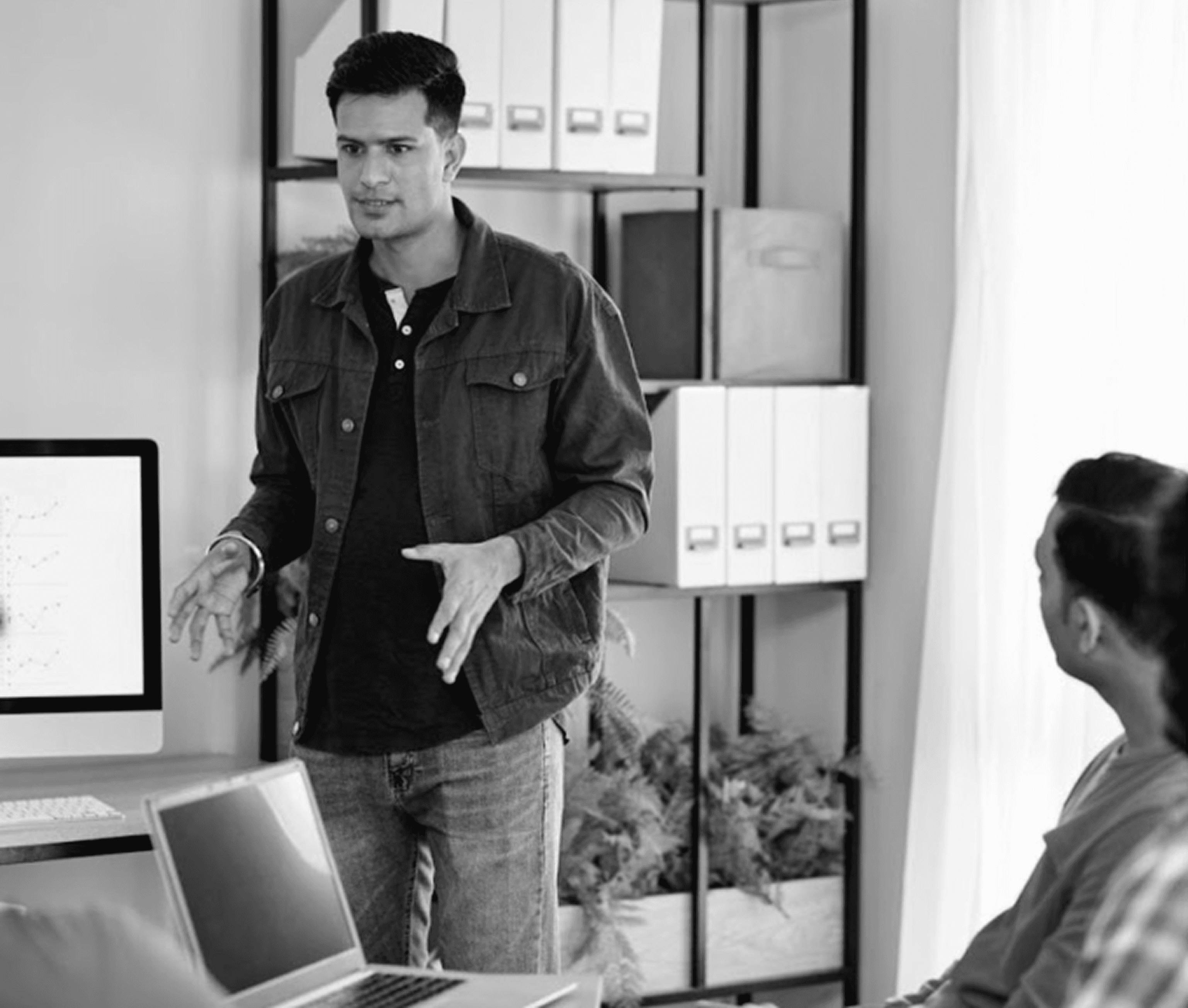 man explaining something to team 