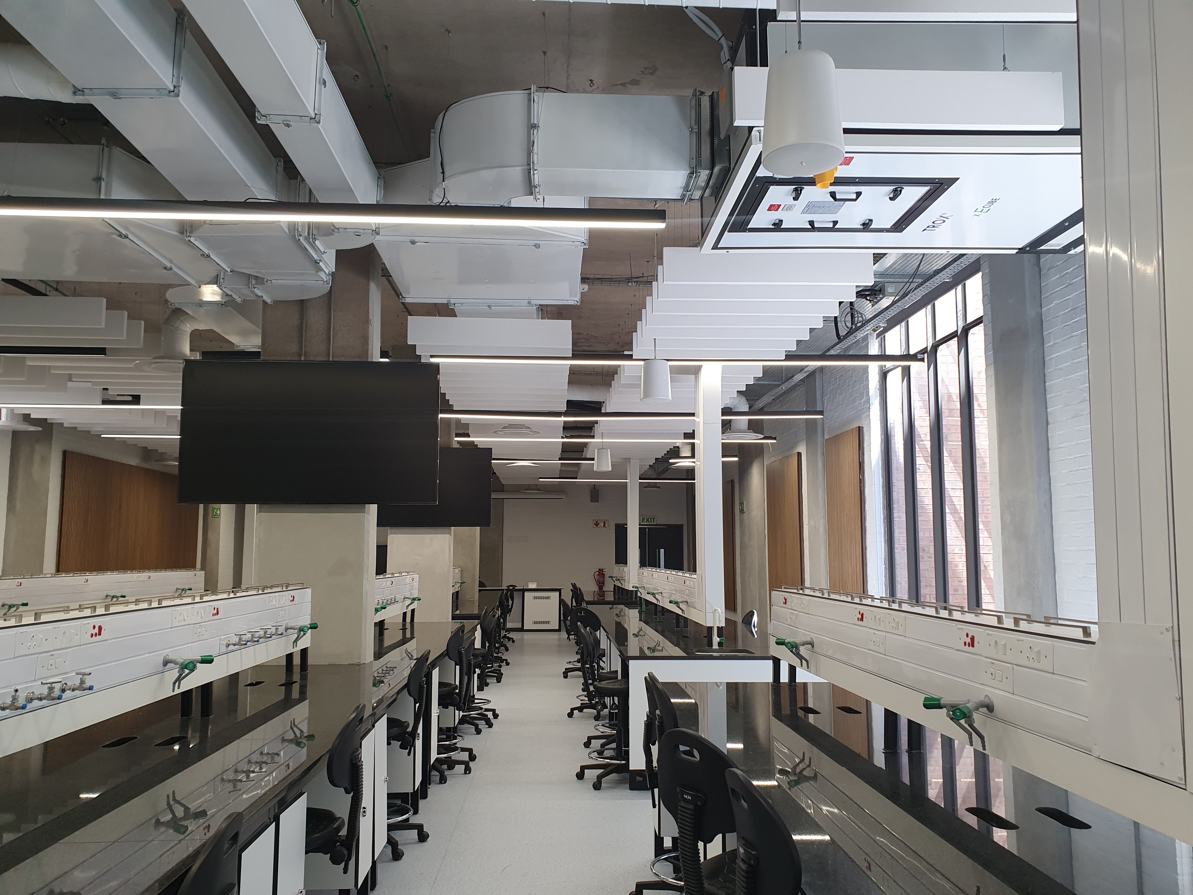 Close-up of white bicycle frame with a logo.