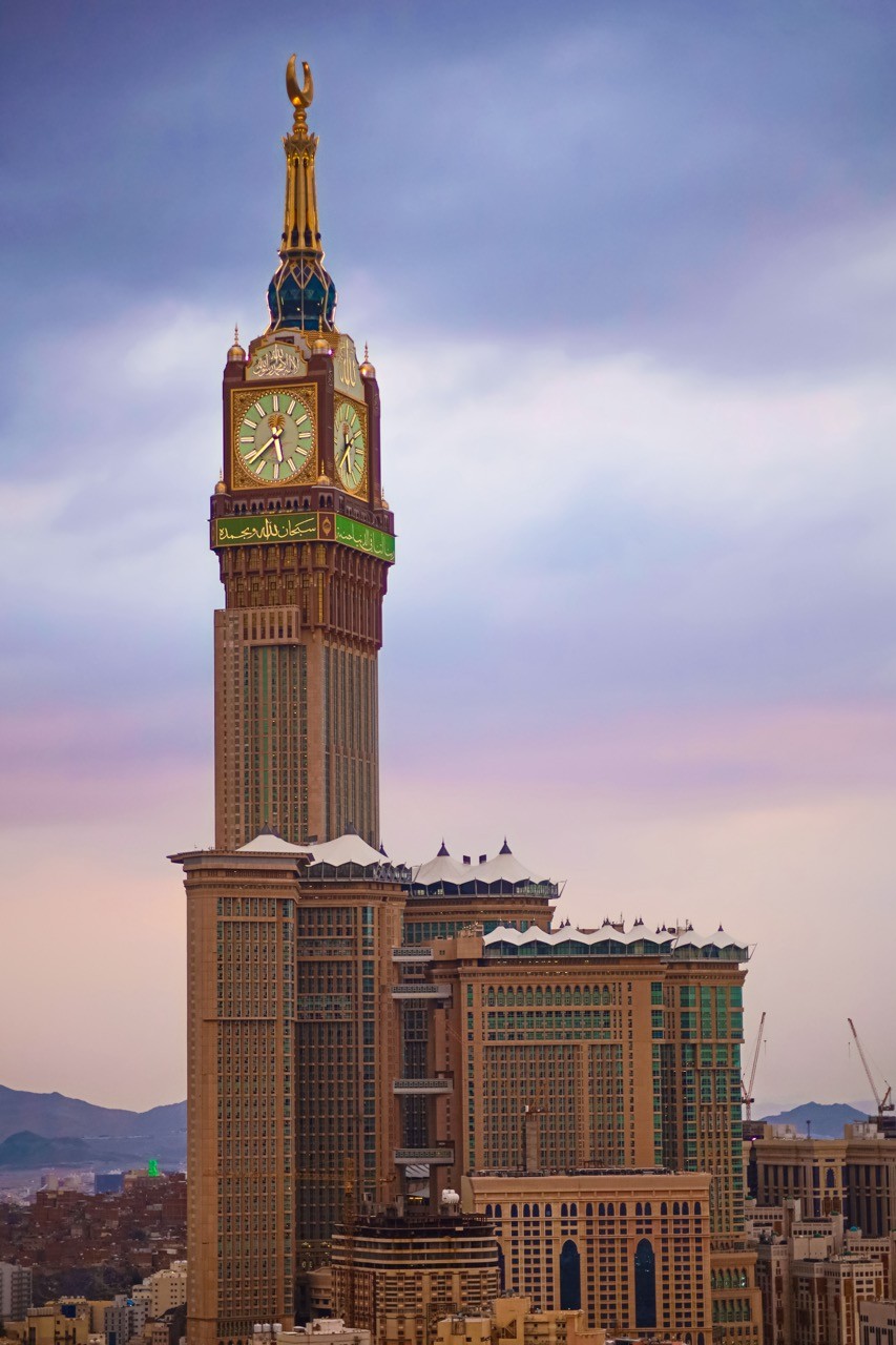 The iconic Clock Tower in Makkah against a dusky sky, symbolizing the blend of tradition and modernity that SAA Law embraces in its mission to provide tailored and forward-thinking legal solutions.