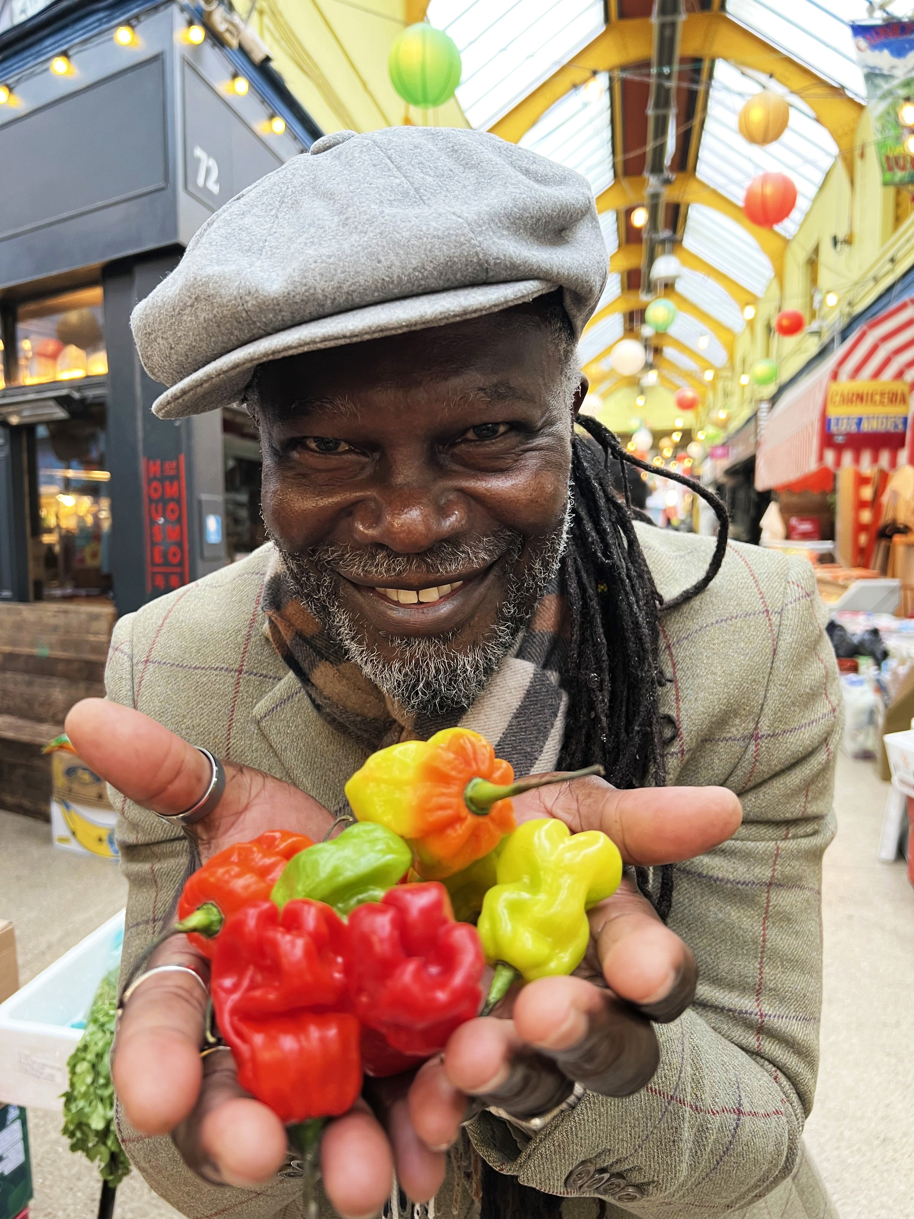 Levi Roots holding scotch bonnet chillis