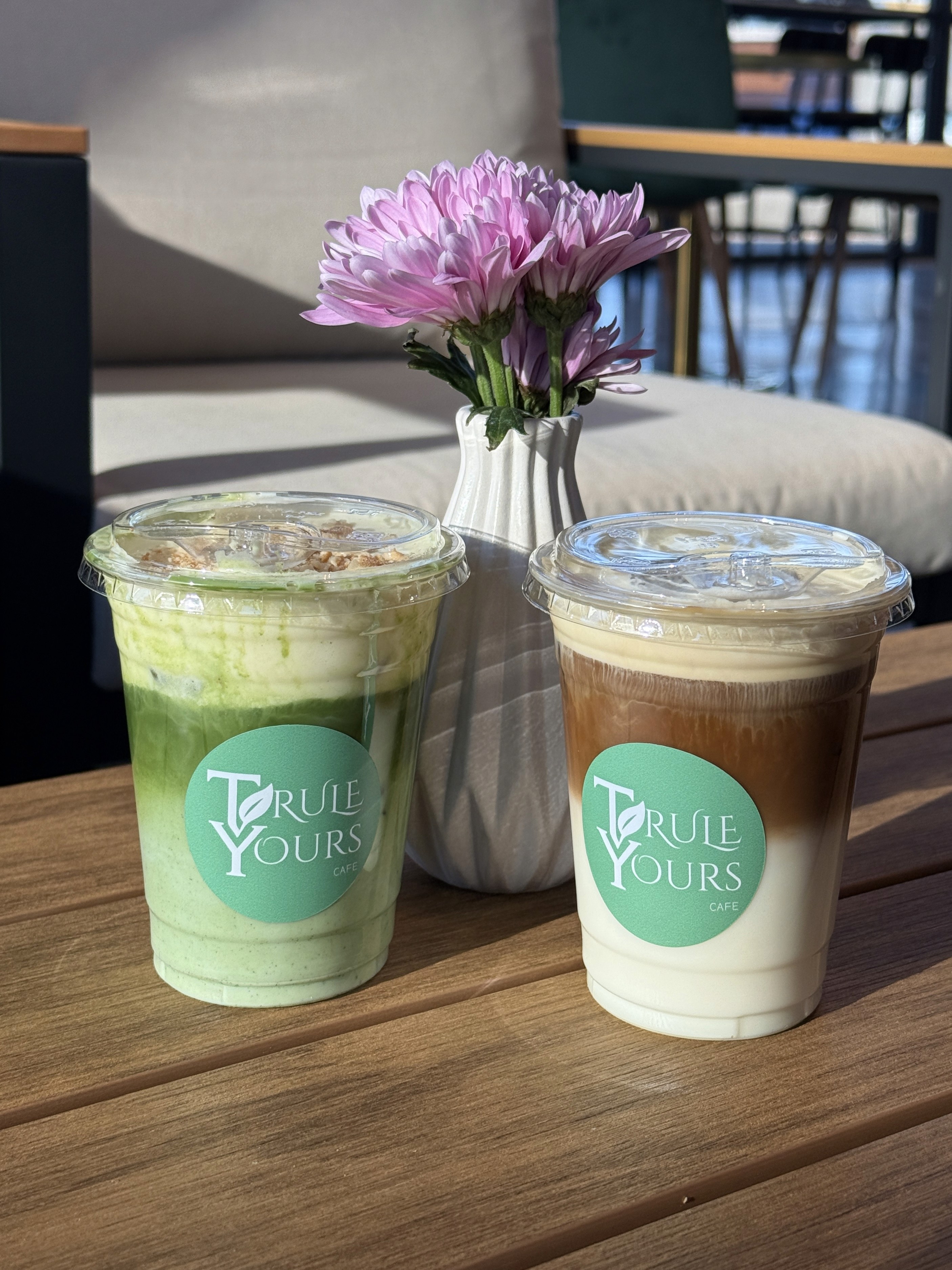 A matcha latte and coffee inside Trule Yours Cafe in Seattle