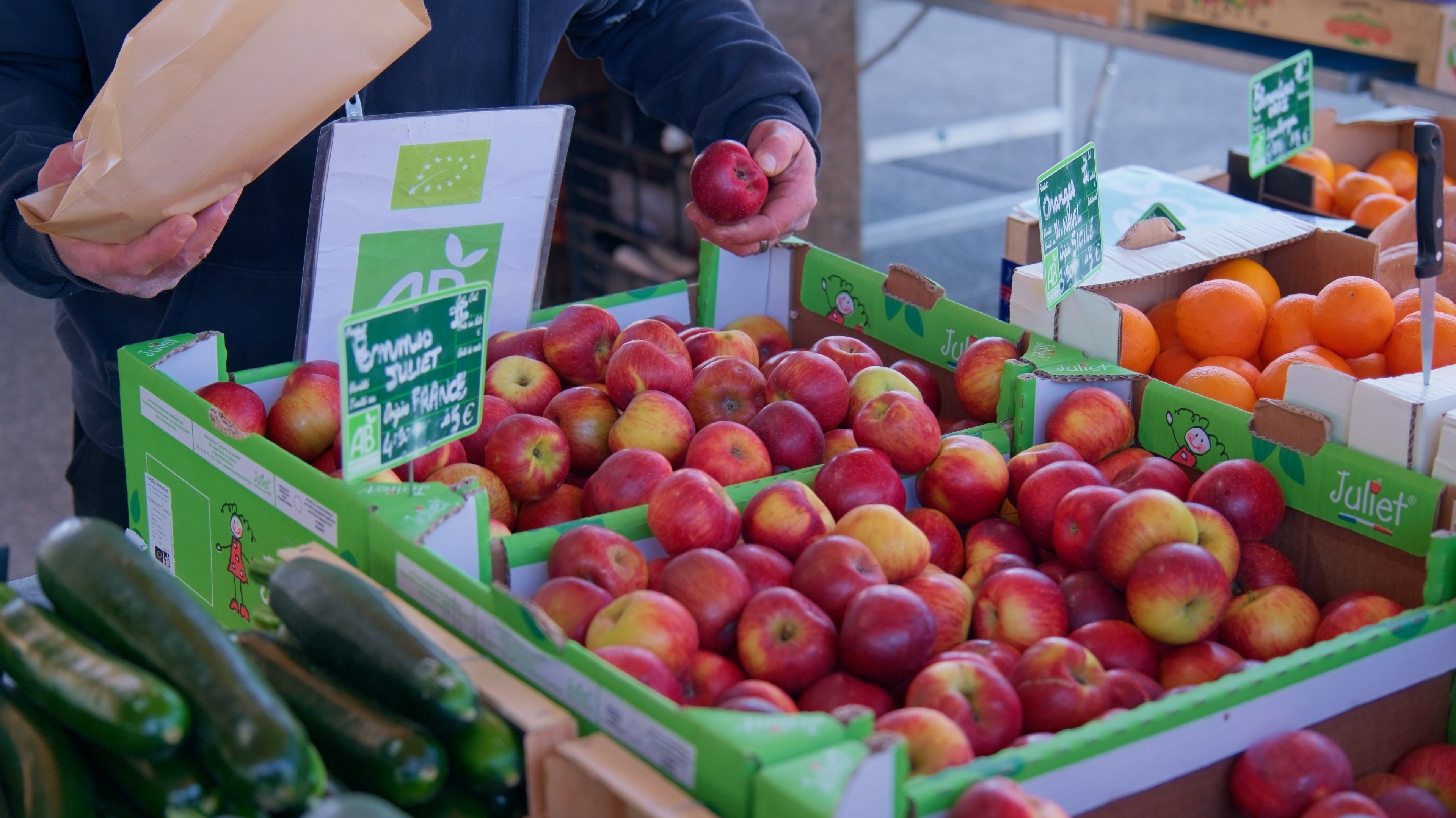 Modern living room with large modular sofa and television.