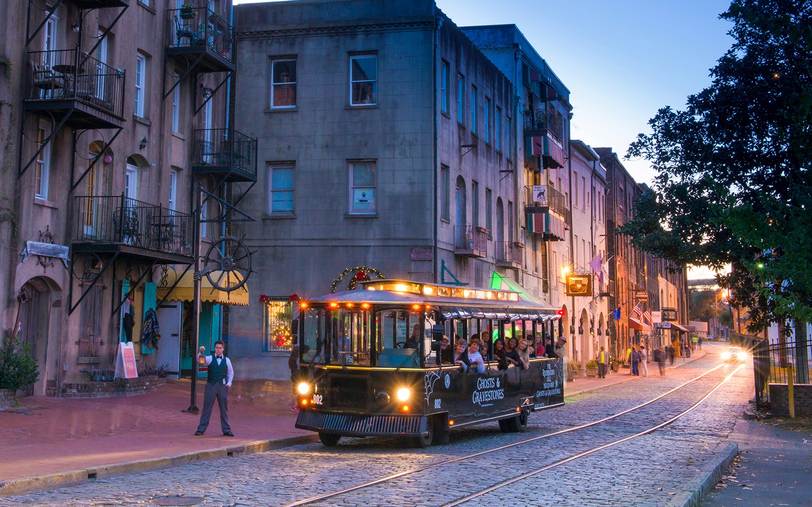 Trolley tour on cobblestone street during Boston Ghosts & Gravestones experience.
