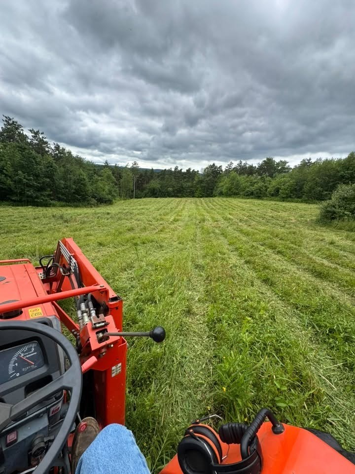 Brush hogging a field from the tractor cab in Central New York