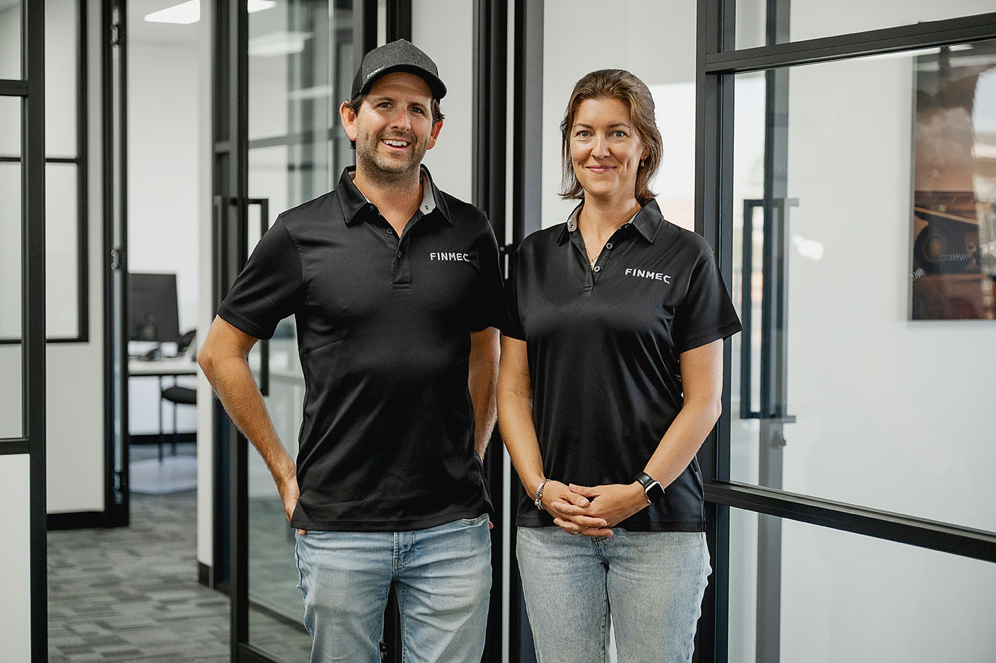 Cluster of translucent pink glass pendant spheres hanging on white—modern lighting décor.