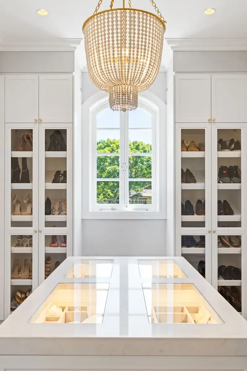 Walk in wardrobe with tailored organisation spaces