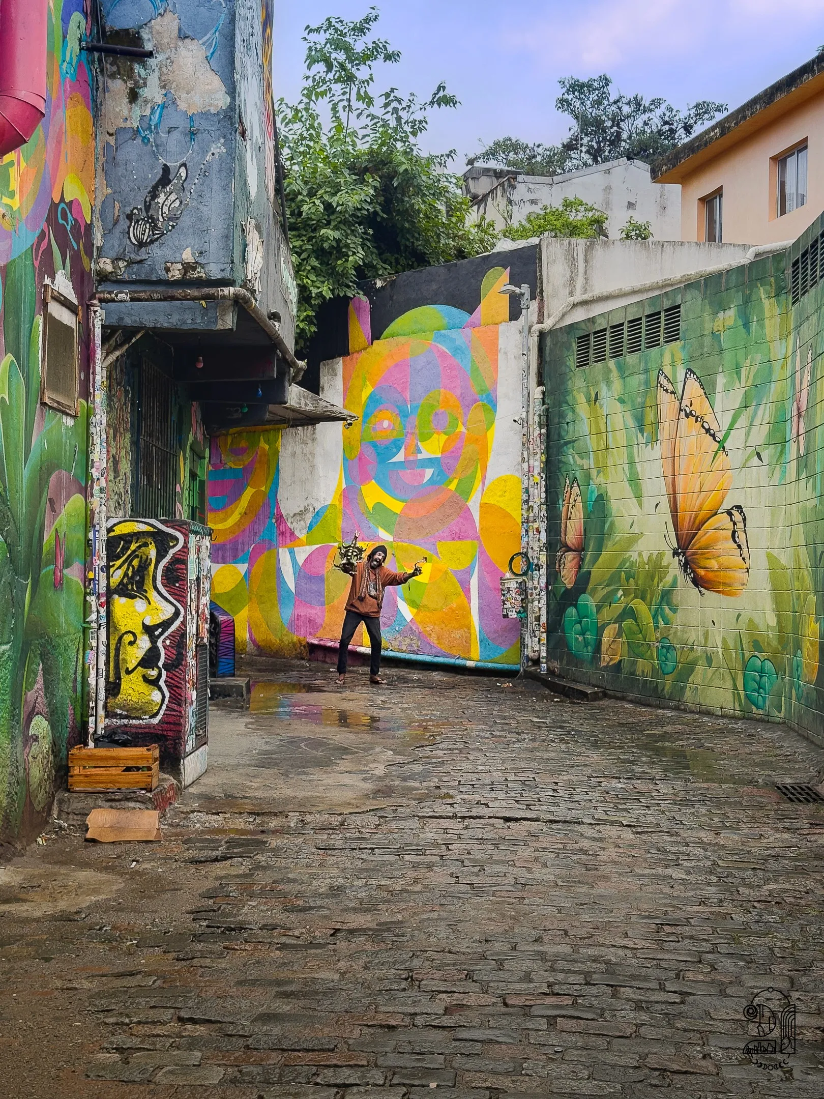 A person clowning in the colorful street of Baco do Batman in Brazil