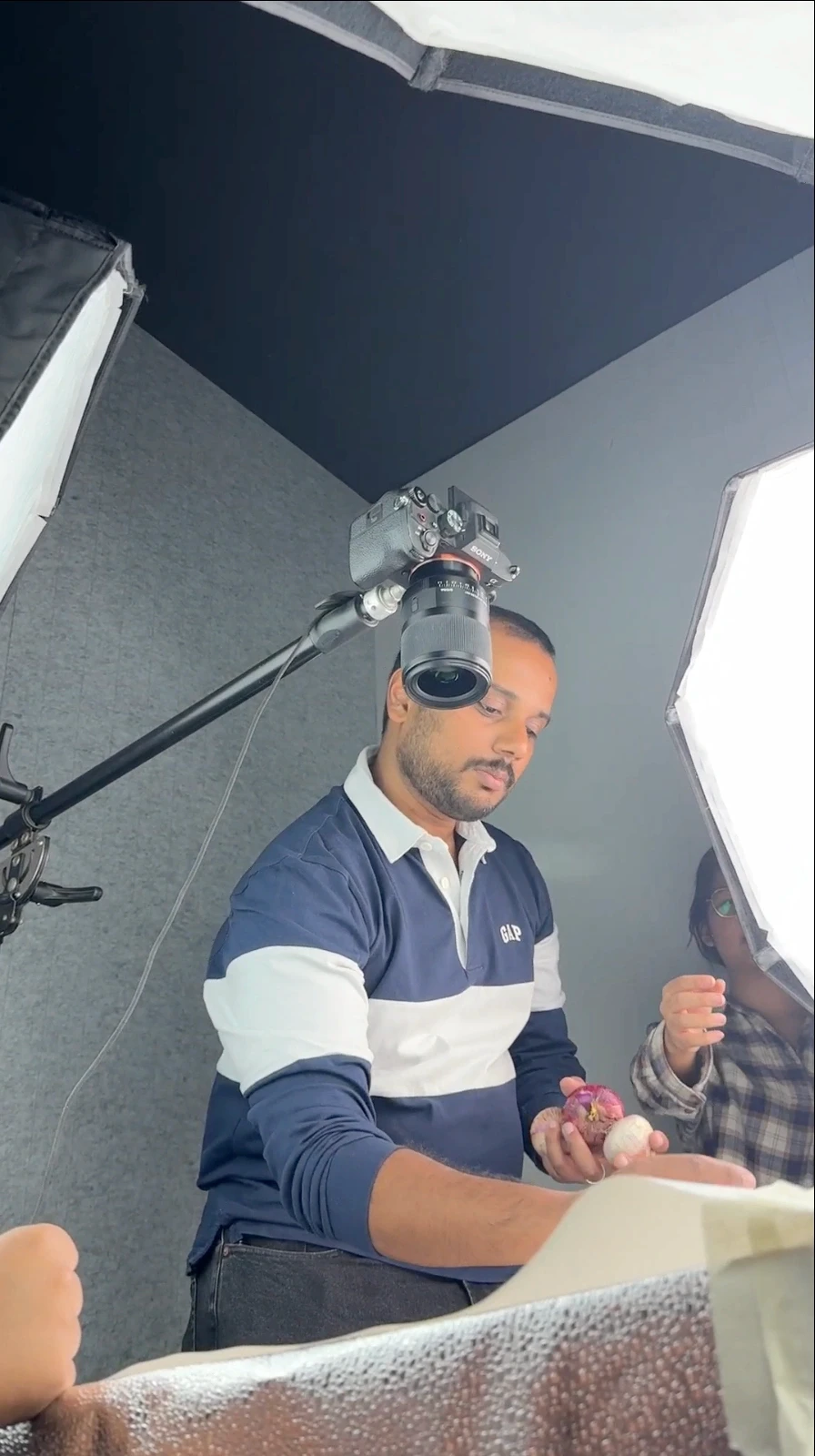Production floor with white backdrop and studio lights