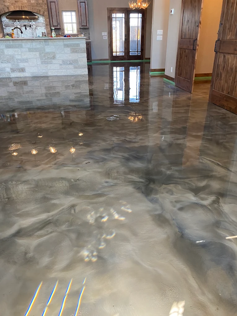 Metallic epoxy floor coating with glossy finish in interior space