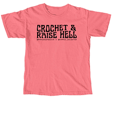 Coral t-shirt with "Crochet & Raise Hell" in black text.