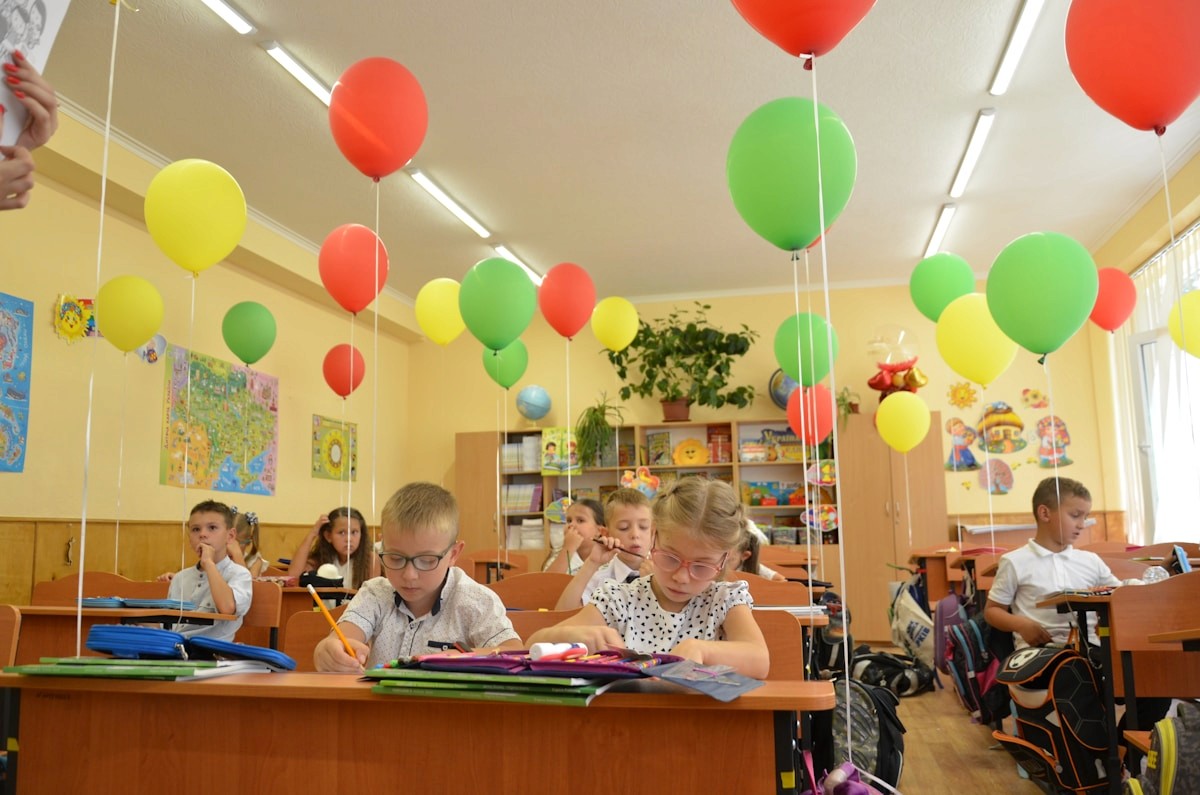 Children learning in a colorful classroom.