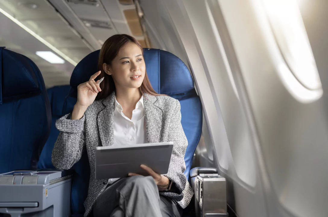 A business woman flying business class