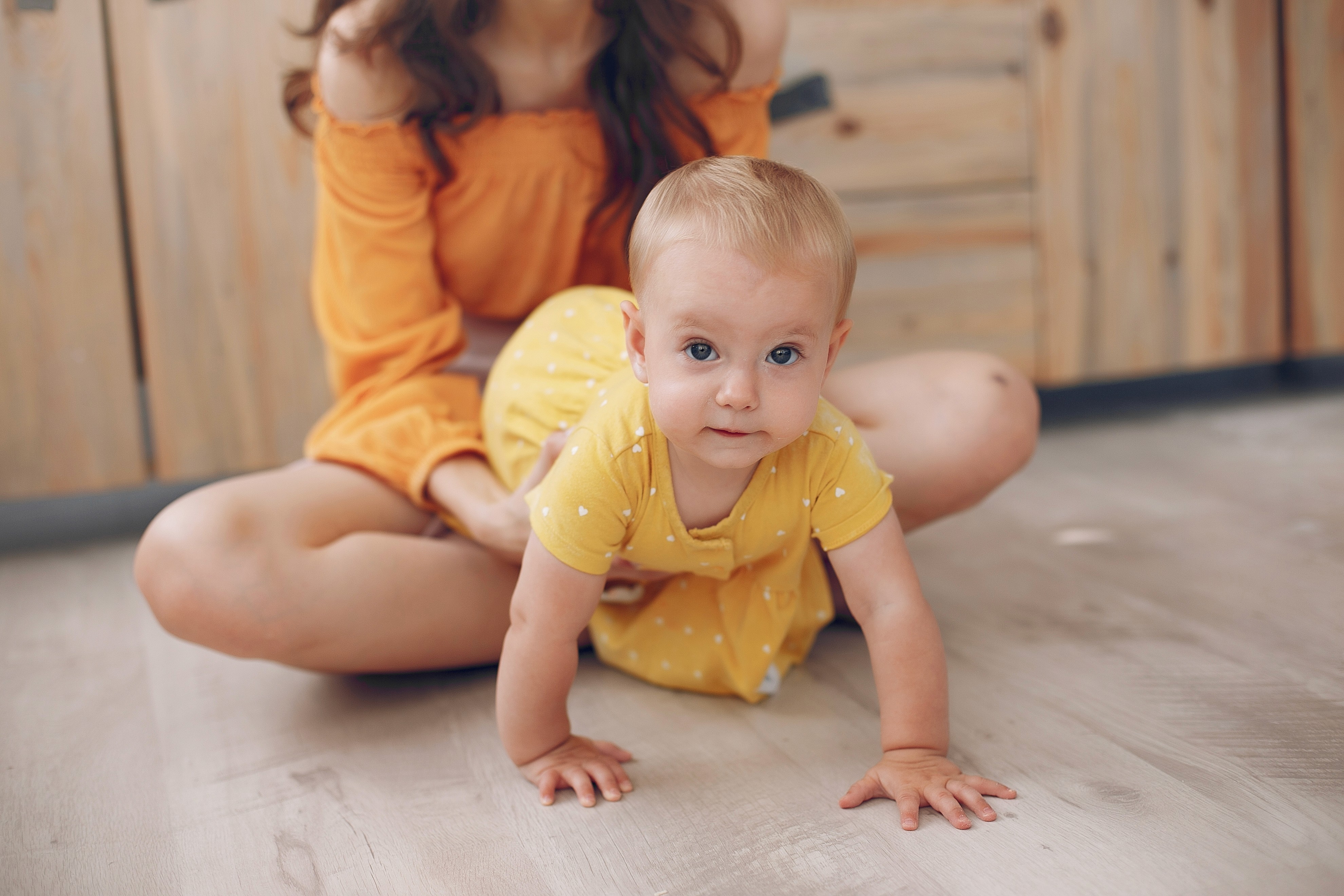 Safe, soft-touch hybrid flooring gives babies a clean, comfortable surface for crawling and everyday play
