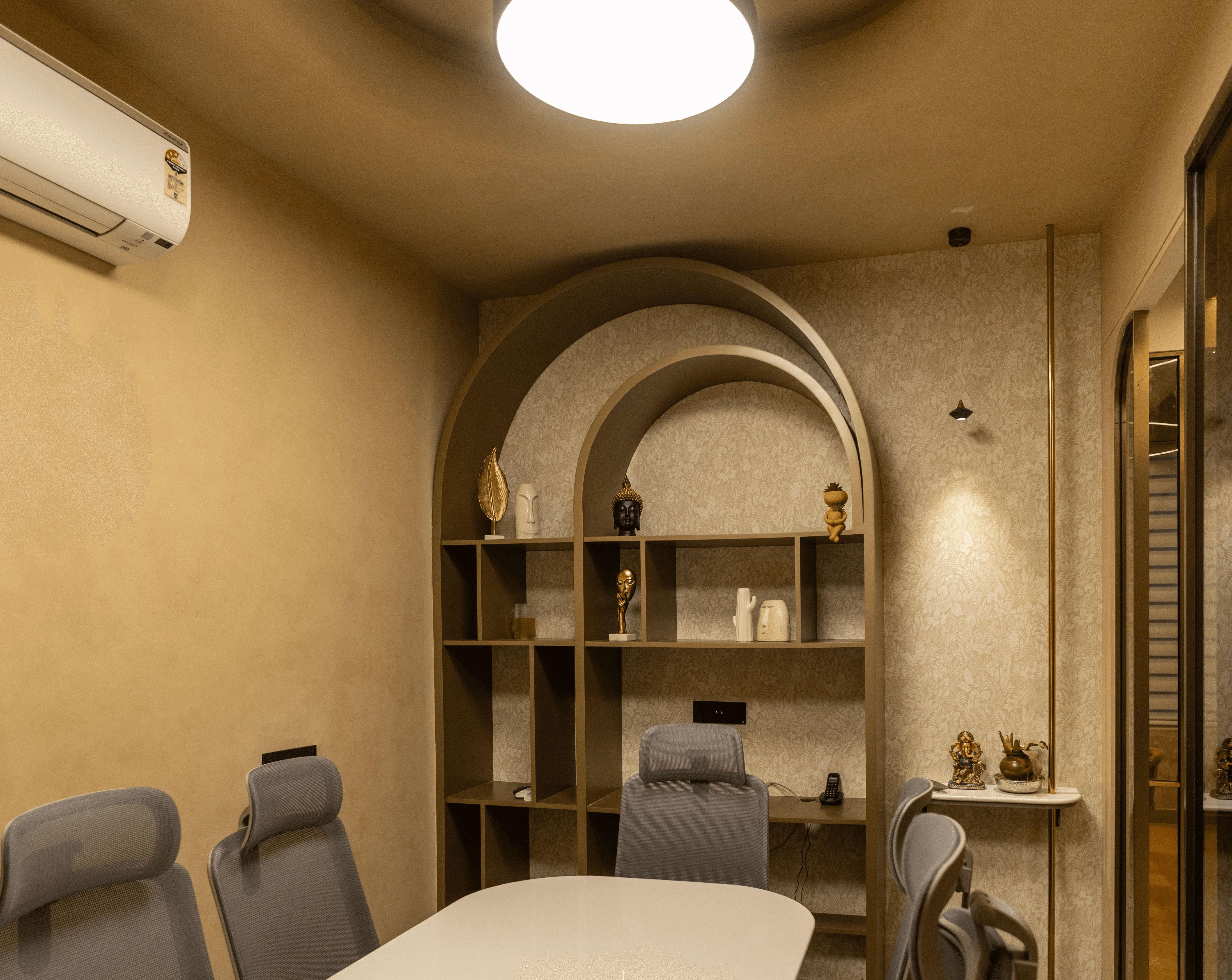 Modern interior entrance with floor-to-ceiling glass walls and warm timber cladding overlooking landscape