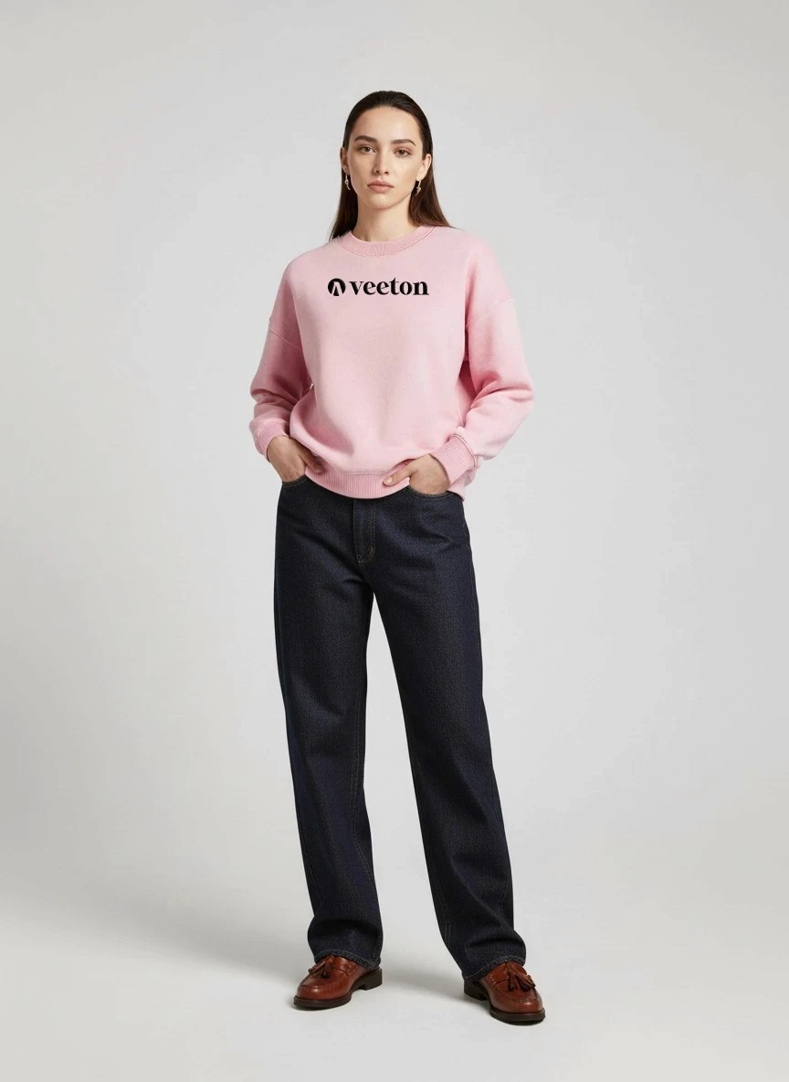 AI fashion model with long brown hair in pink Veeton sweatshirt and black jeans with brown loafers