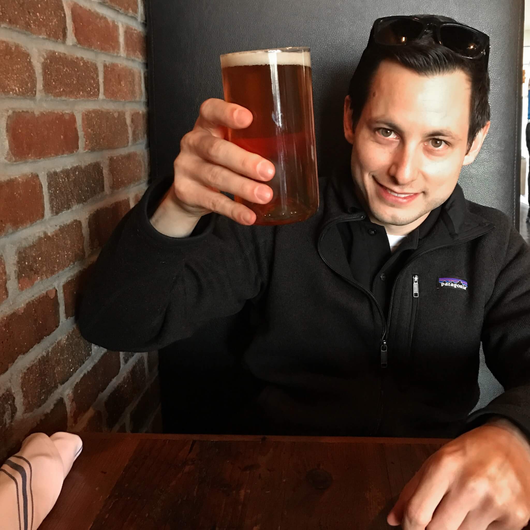 a man holding a drink