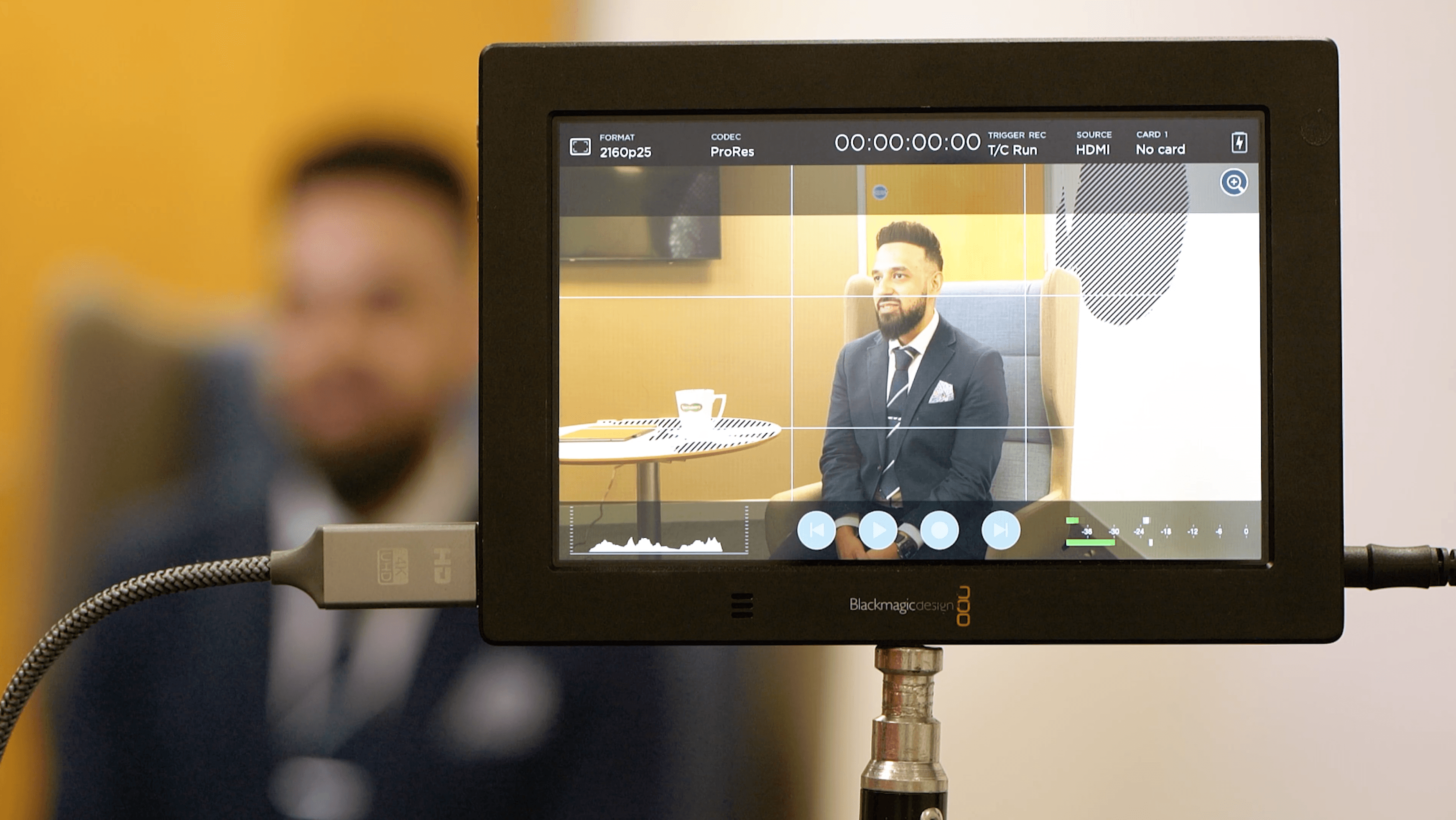 A video production monitor on set of an interview. 