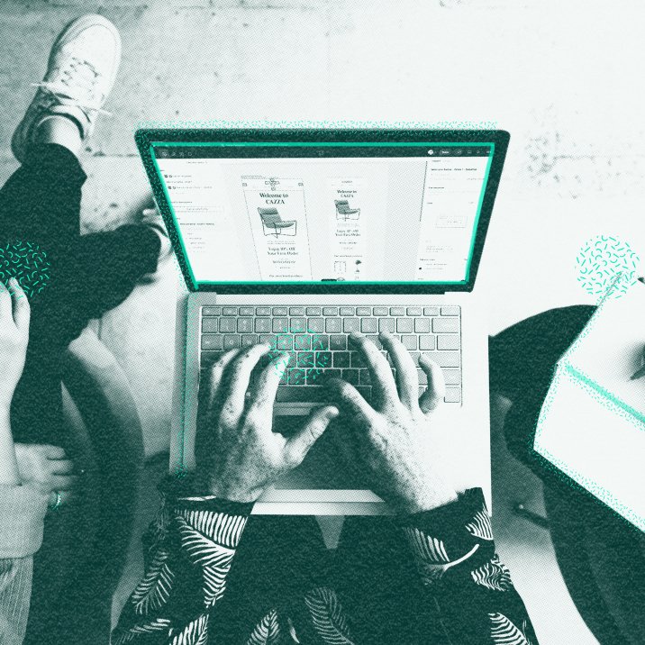 A person typing on a laptop at a desk
