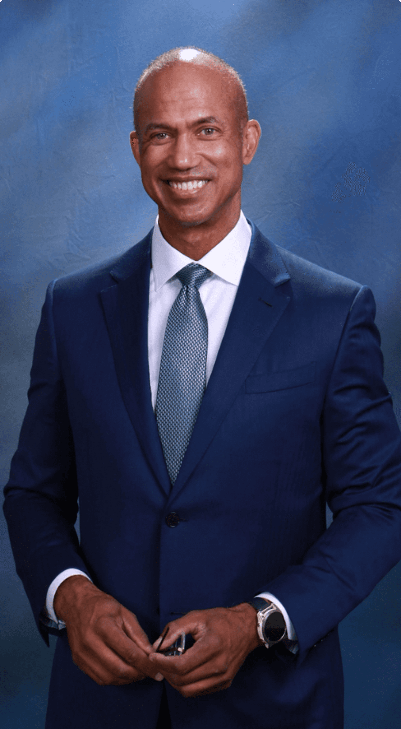 selective focus bokeh photography of man with broad smile