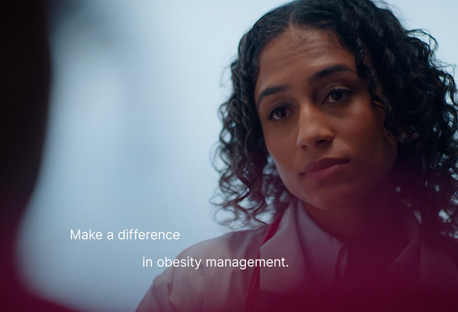 A woman with curly hair listens intently; text on image reads, "Make a difference in obesity management.