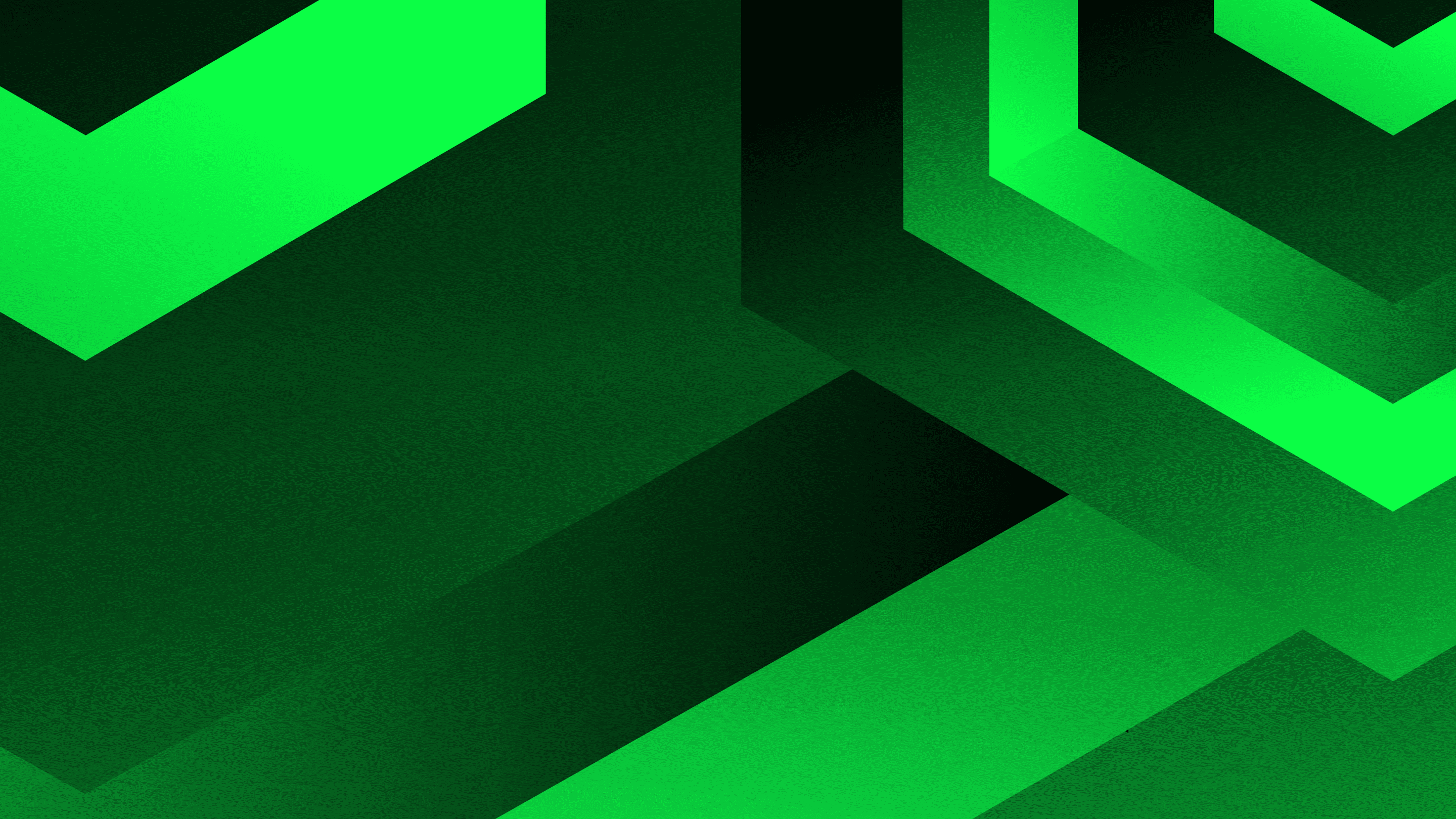 man wearing grey t-shirt standing in front of man sitting on chair