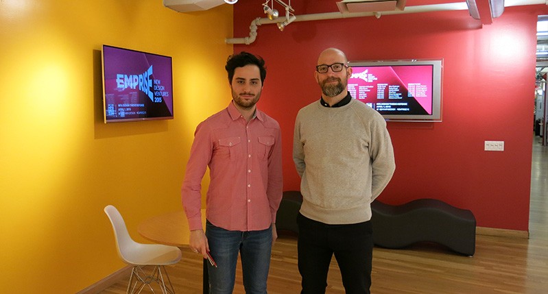 two men in front of screen lobby