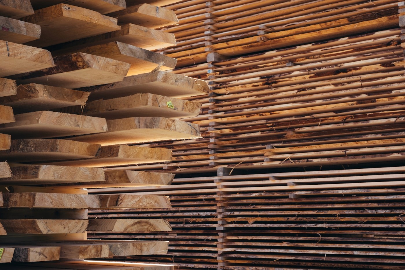 Stacked lumber boards showing varied widths and natural movement