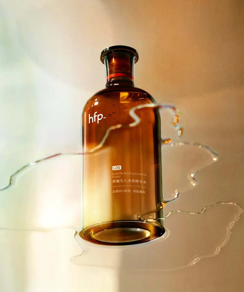 Stainless steel water bottle on orange background