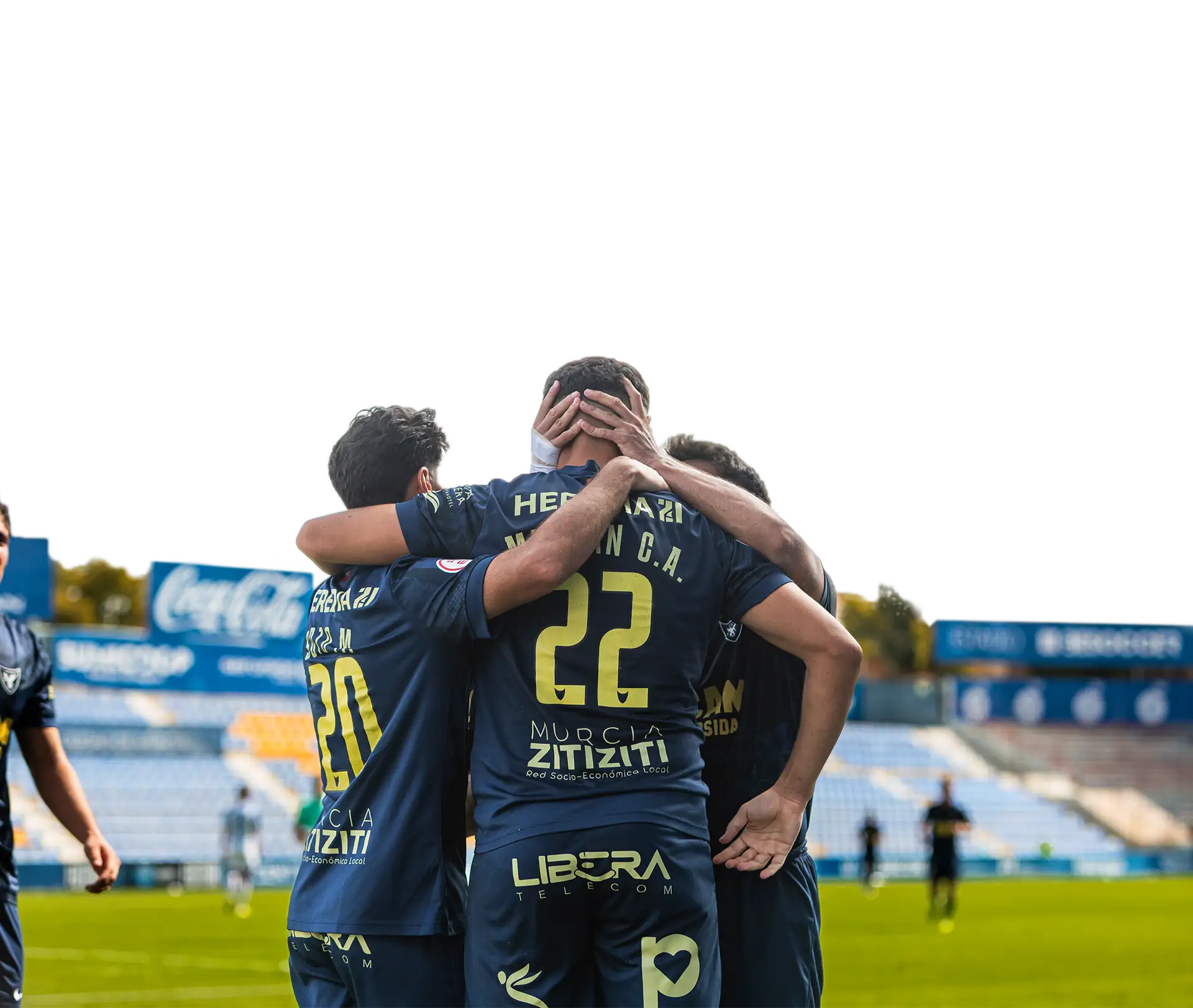 Jugadores del UCAM International Football Team abrazándose tras marcar un gol durante un partido en La Condomina | UCAM Universidad Católica de Murcia