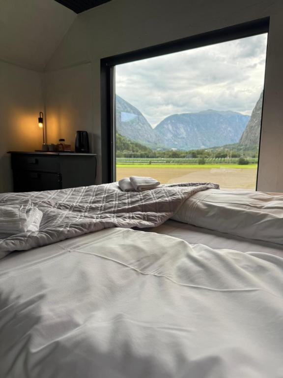 Dark wood console table with tall blue vases
