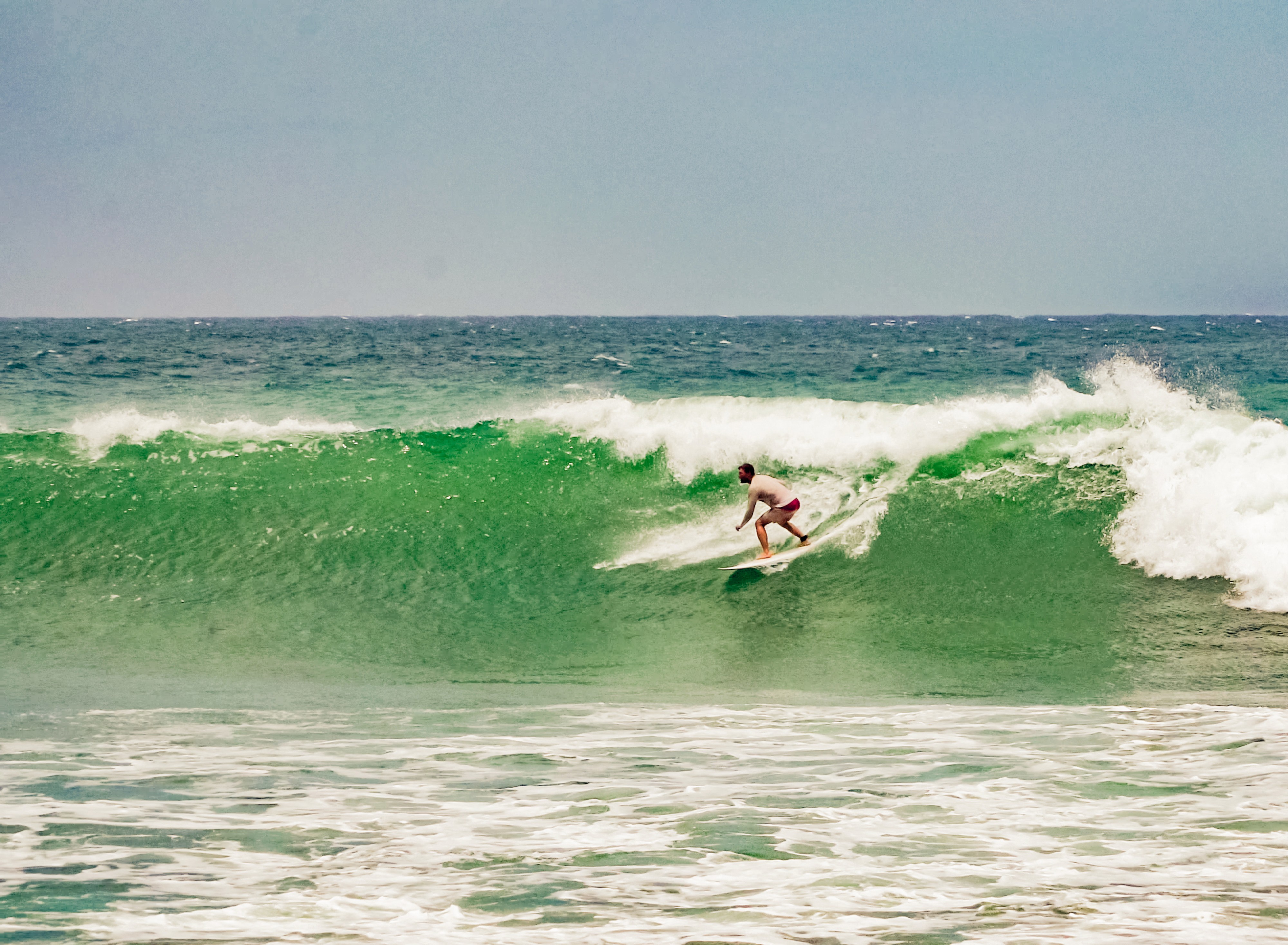 Tobi Deckert, sports model, watersports at the sea, board