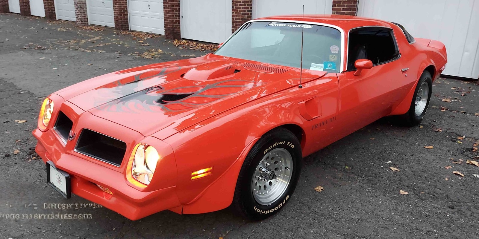 A vibrant 1976 Pontiac Trans Am in pristine condition, showcasing its classic design, ready for film or media projects.