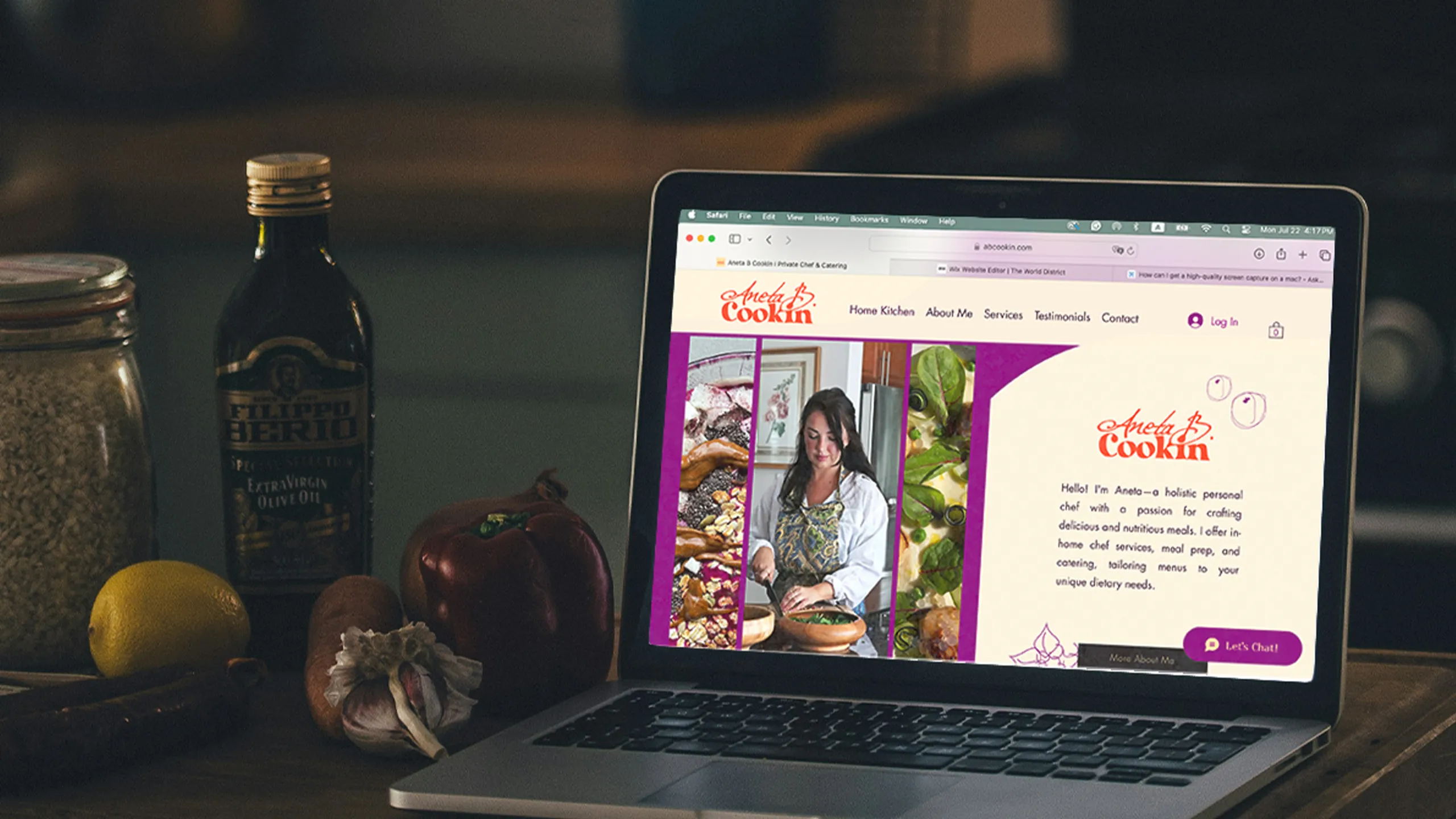Aneta B. Cookin brand identity and website displayed on a MacBook in a kitchen setting. Logo design, visual identity, and Wix website designed and built by The World District.