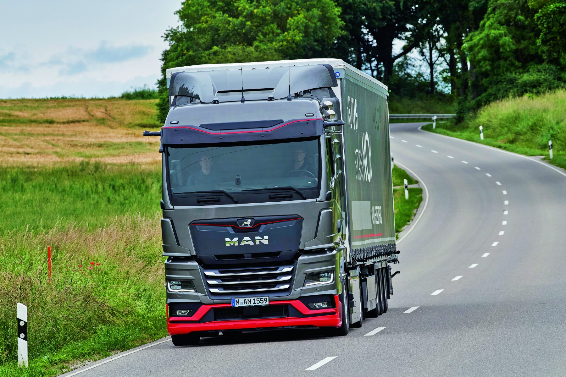 MAN eTGX electric truck on a highway, showcasing zero-emission heavy-duty transport.