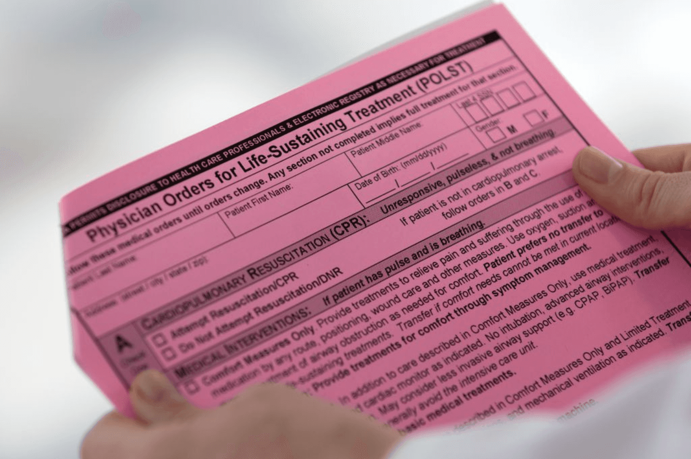 woman holding s POLST form