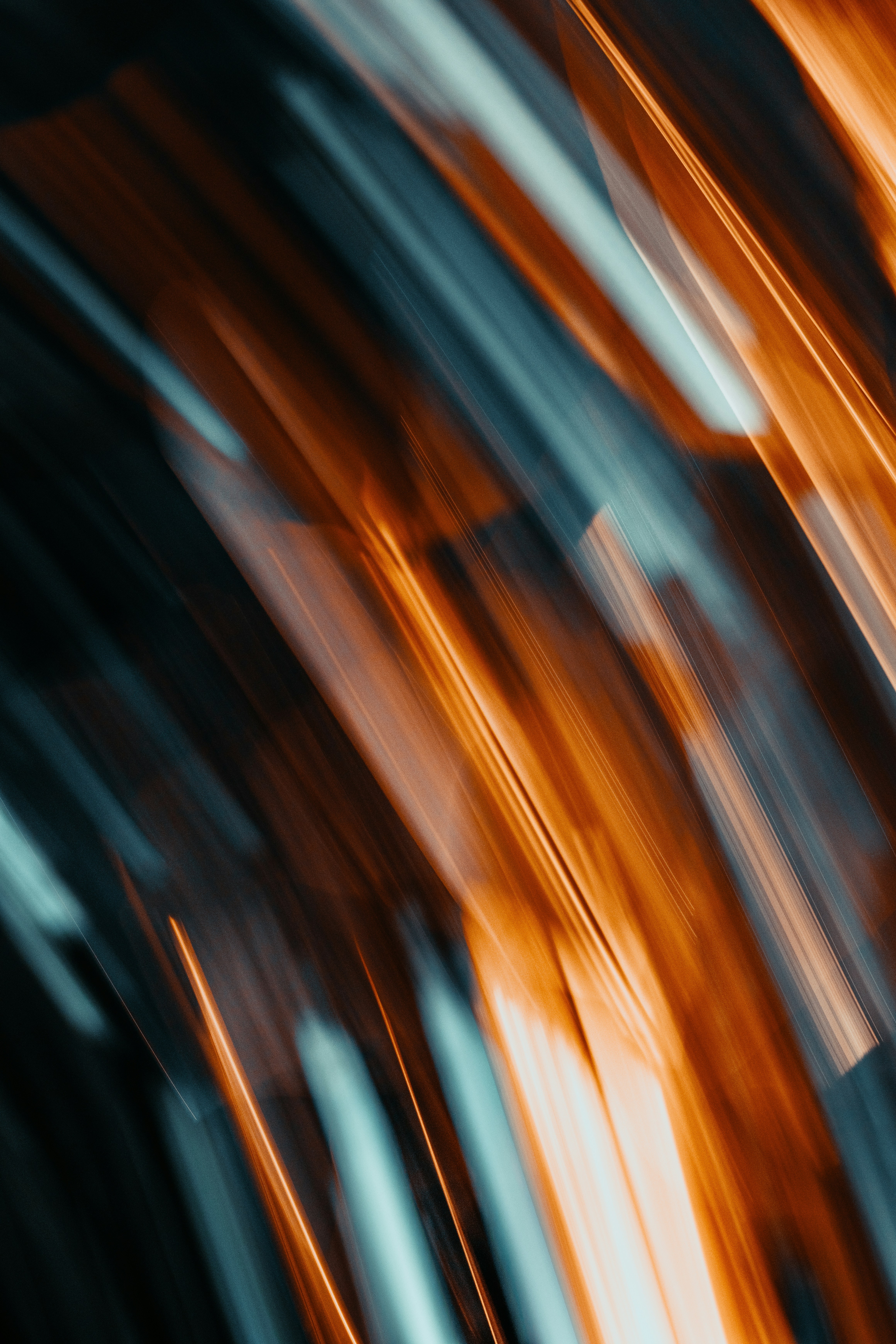 Abstract streaks of orange and blue light