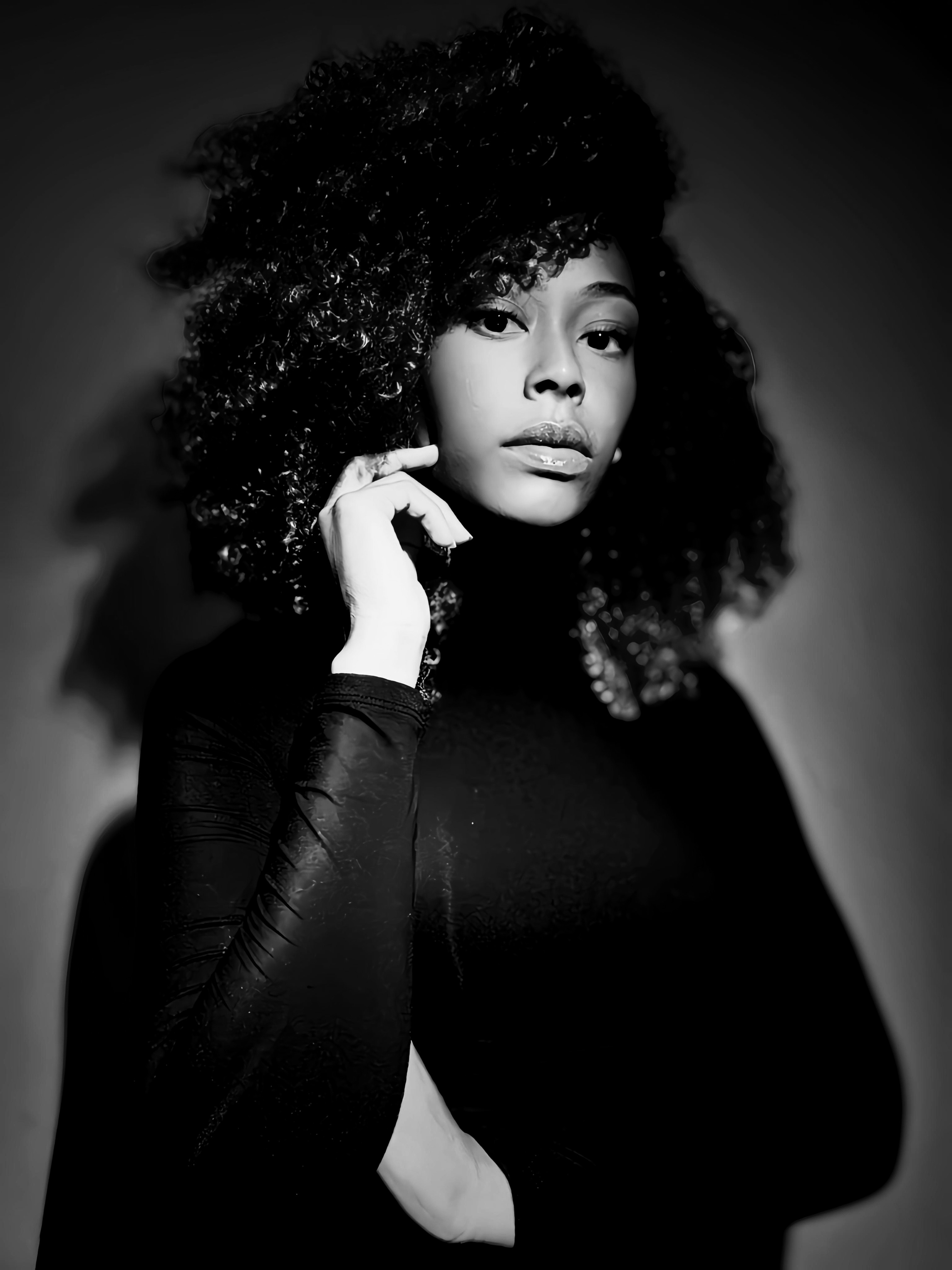 a blurry photo of a person standing in front of a wall