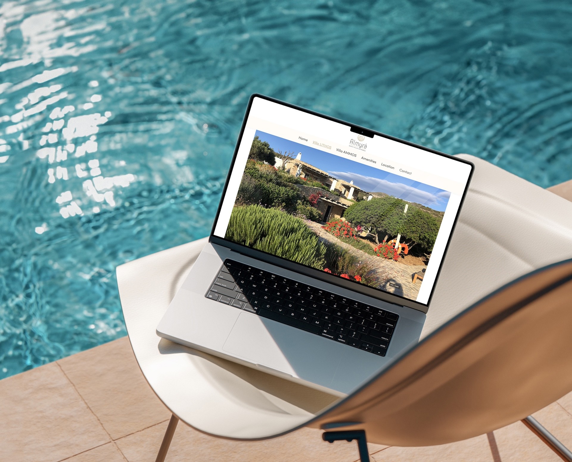 Almyra Antiparos website design displayed on laptop beside a swimming pool