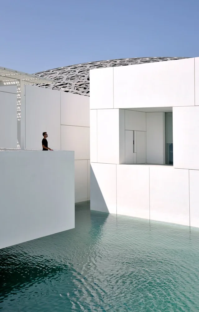 white concrete building with swimming pool