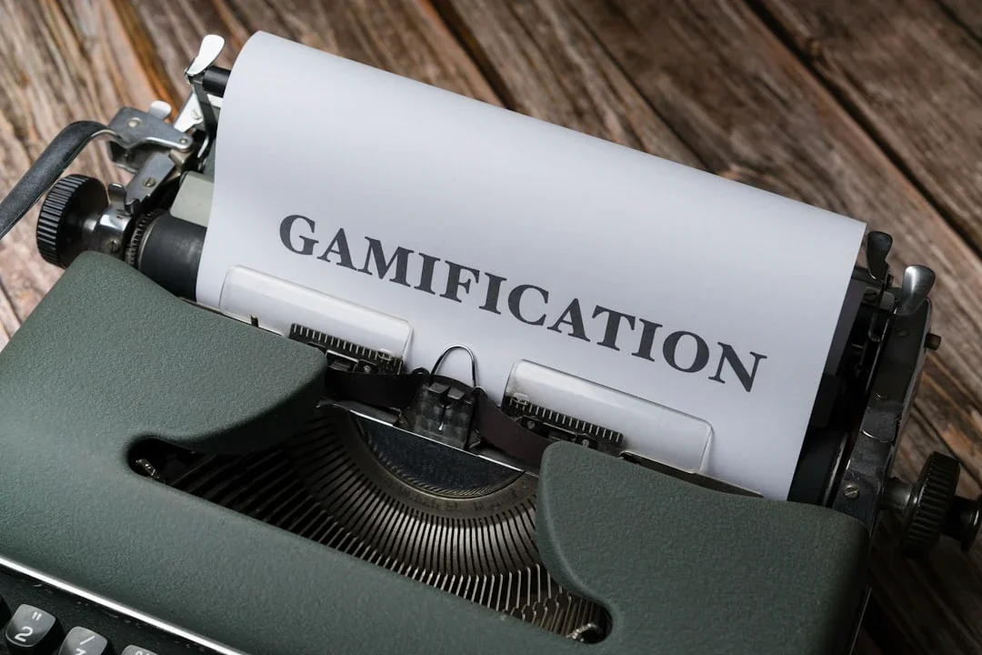 a close up of a typewriter with a paper that reads gamification
