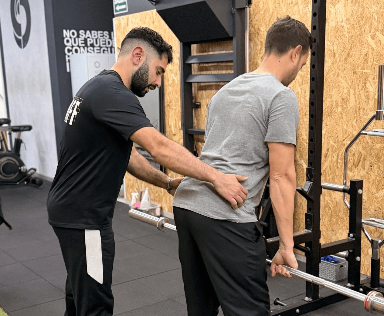 man in black shorts and black tank top doing push up