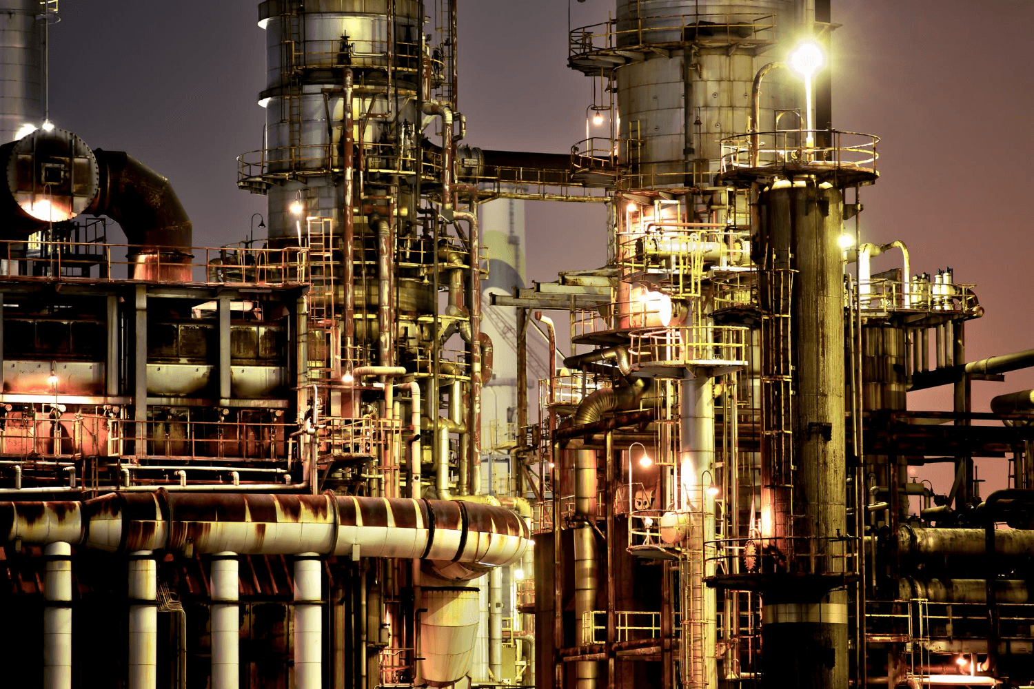 man in brown hat holding black and gray power tool
