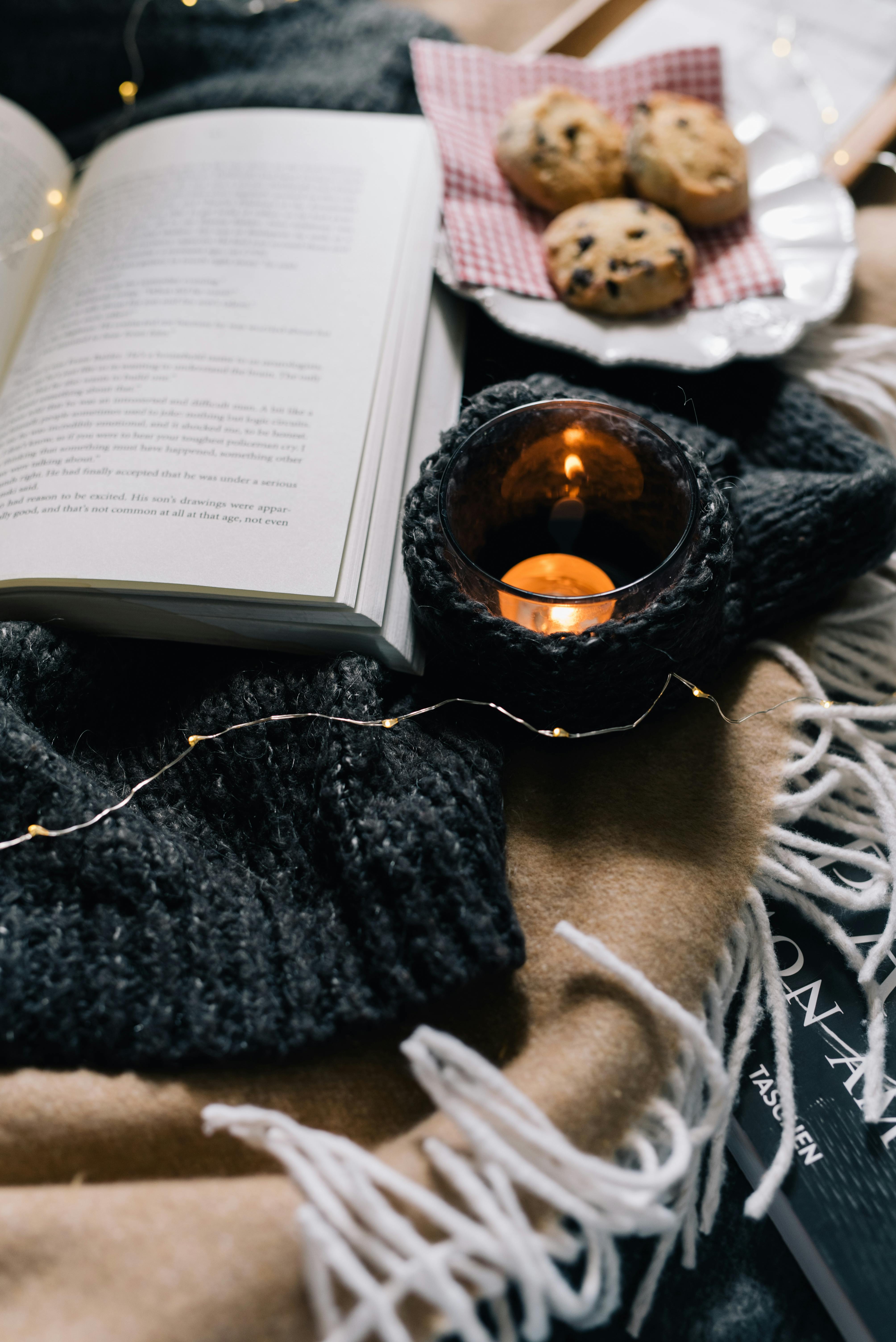 A candle, a book, and cookies.