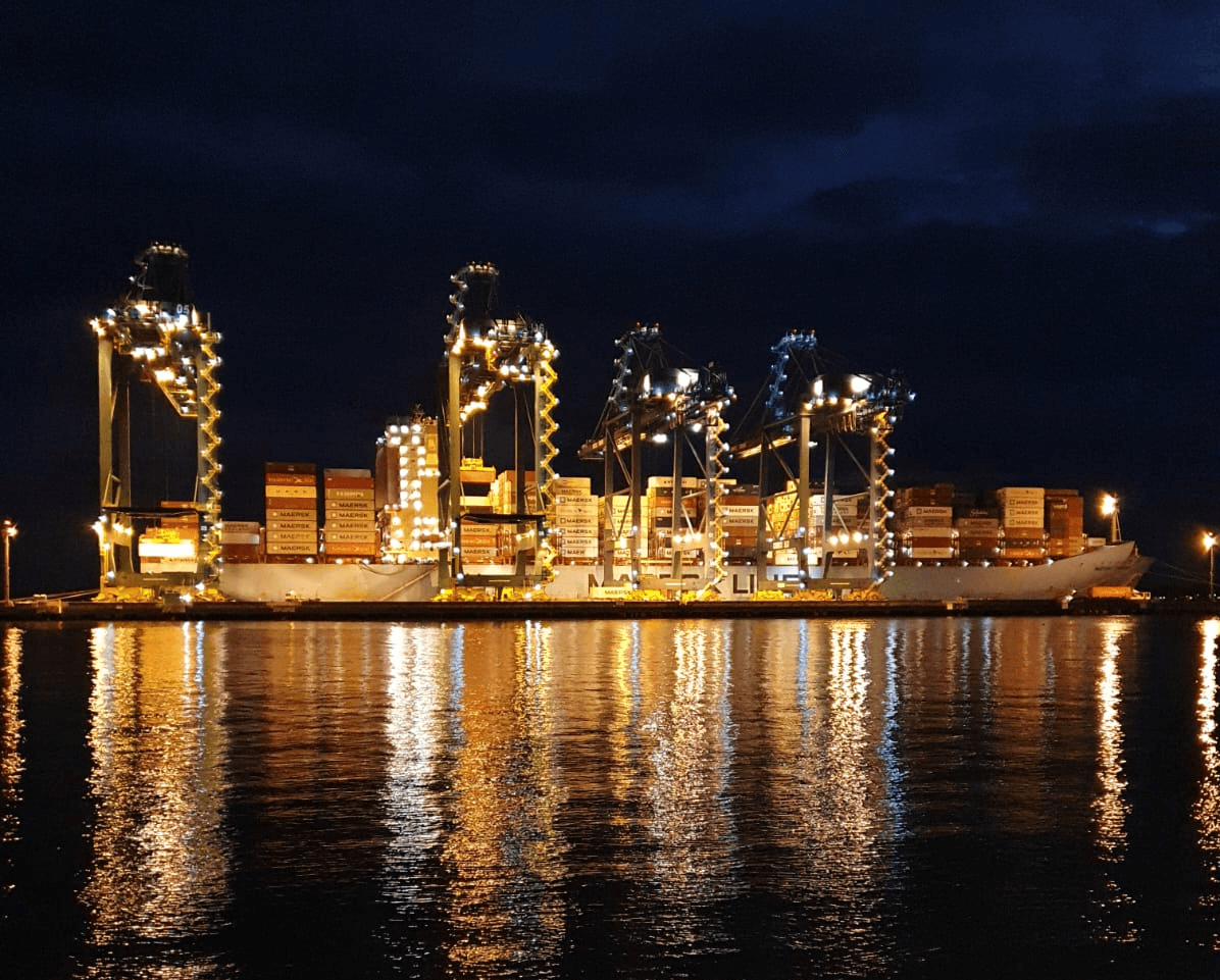 a group of people walking on a sidewalk