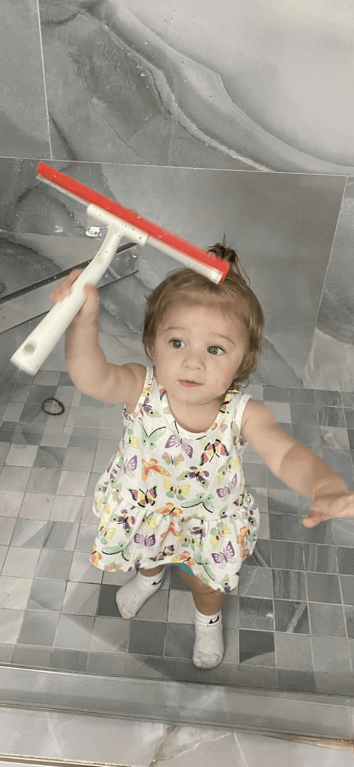 Cleaning inside windows with microfiber cloth and eco-friendly solution.