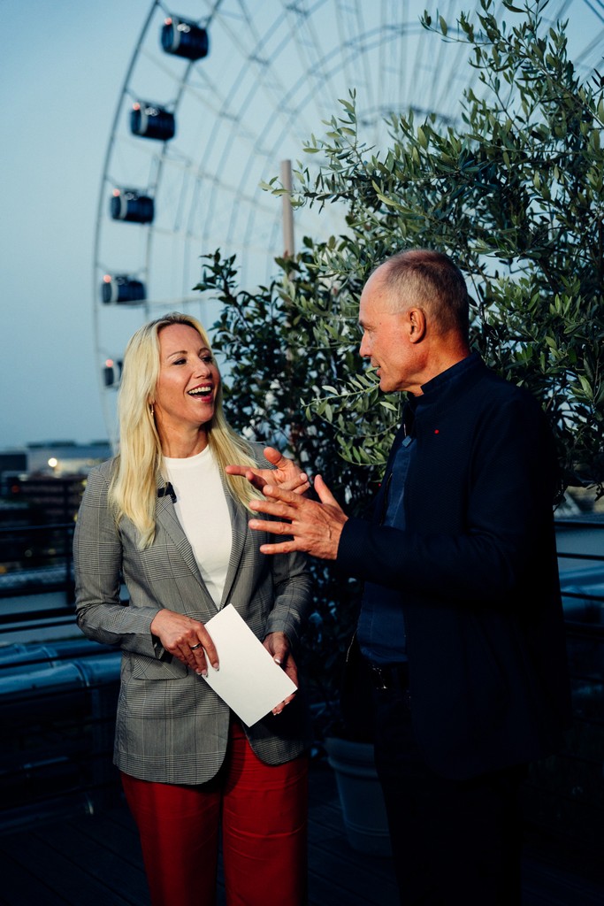 Two people engaged in a conversation during an interview