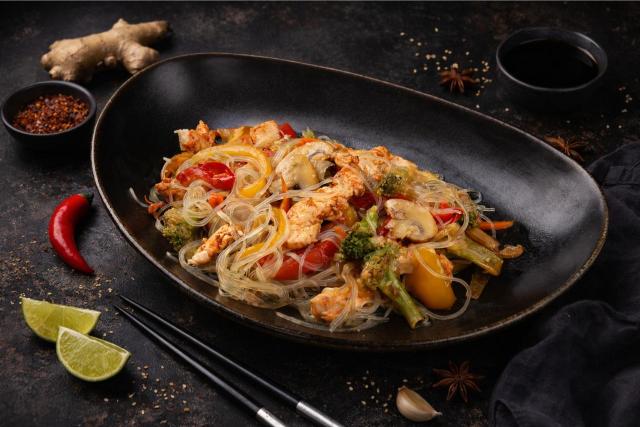 a white plate topped with meat covered in sauce