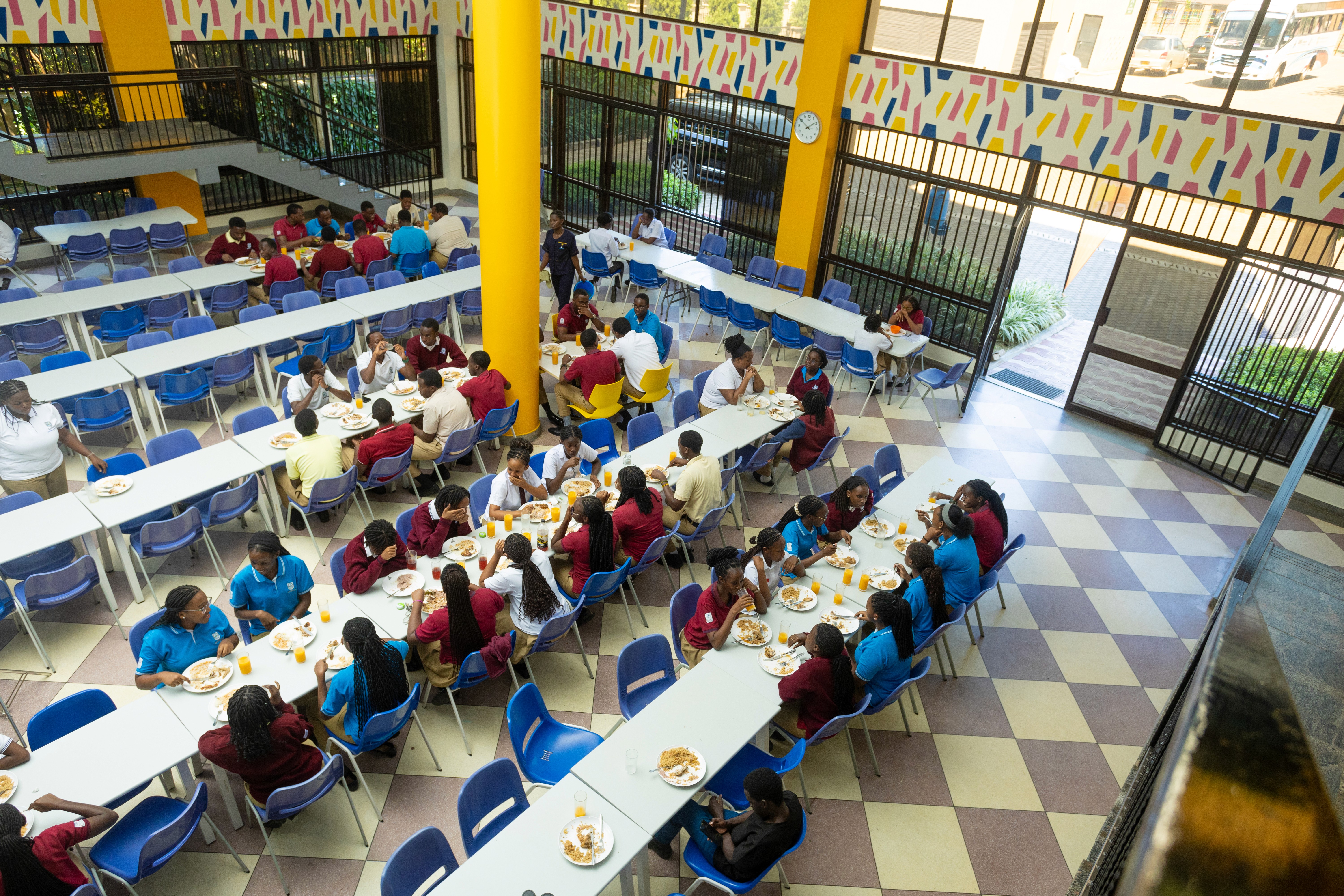 A student stands with a backpack on, ready for school