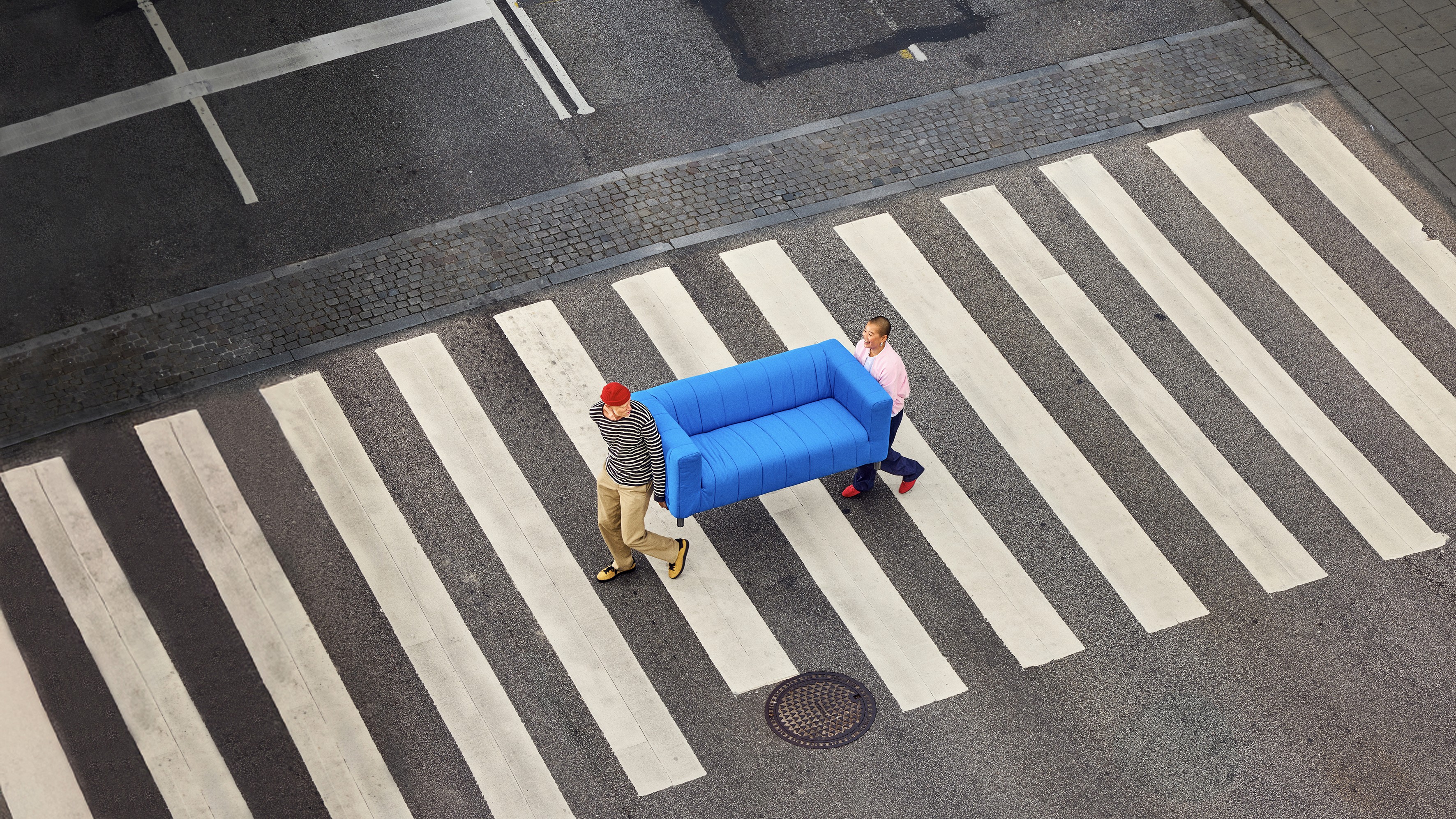 two people looking at a tablet and smiling