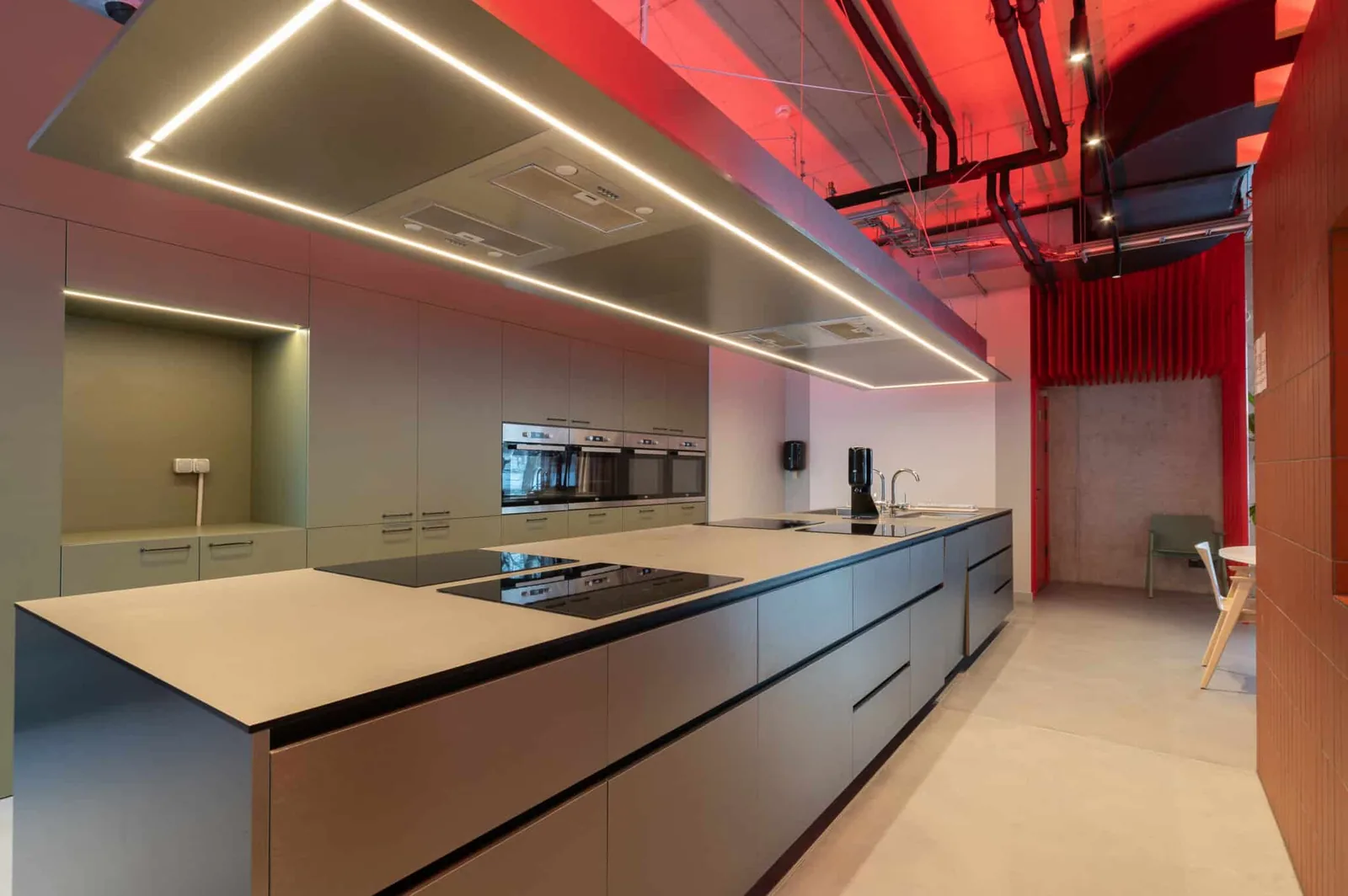 Communal kitchen in student accommodation in Riga with modern cooking facilities and large work surfaces